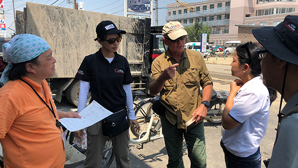 20．JPF emergency response team and Peace Winds Japan are accompanying USAID/OFDA's monitoring the affected areas (In front of Mabi Memorial Hospital)/16th July 2018 ©JPF